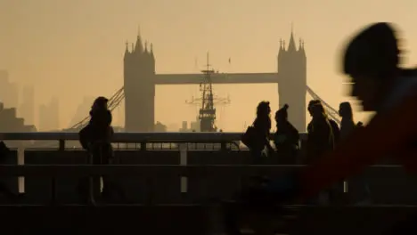 Traffic And Pedestrians In Front Of Tower Bridge