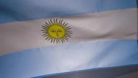 Close Up Studio Shot Of Argentinian Flag Flying Filling Frame