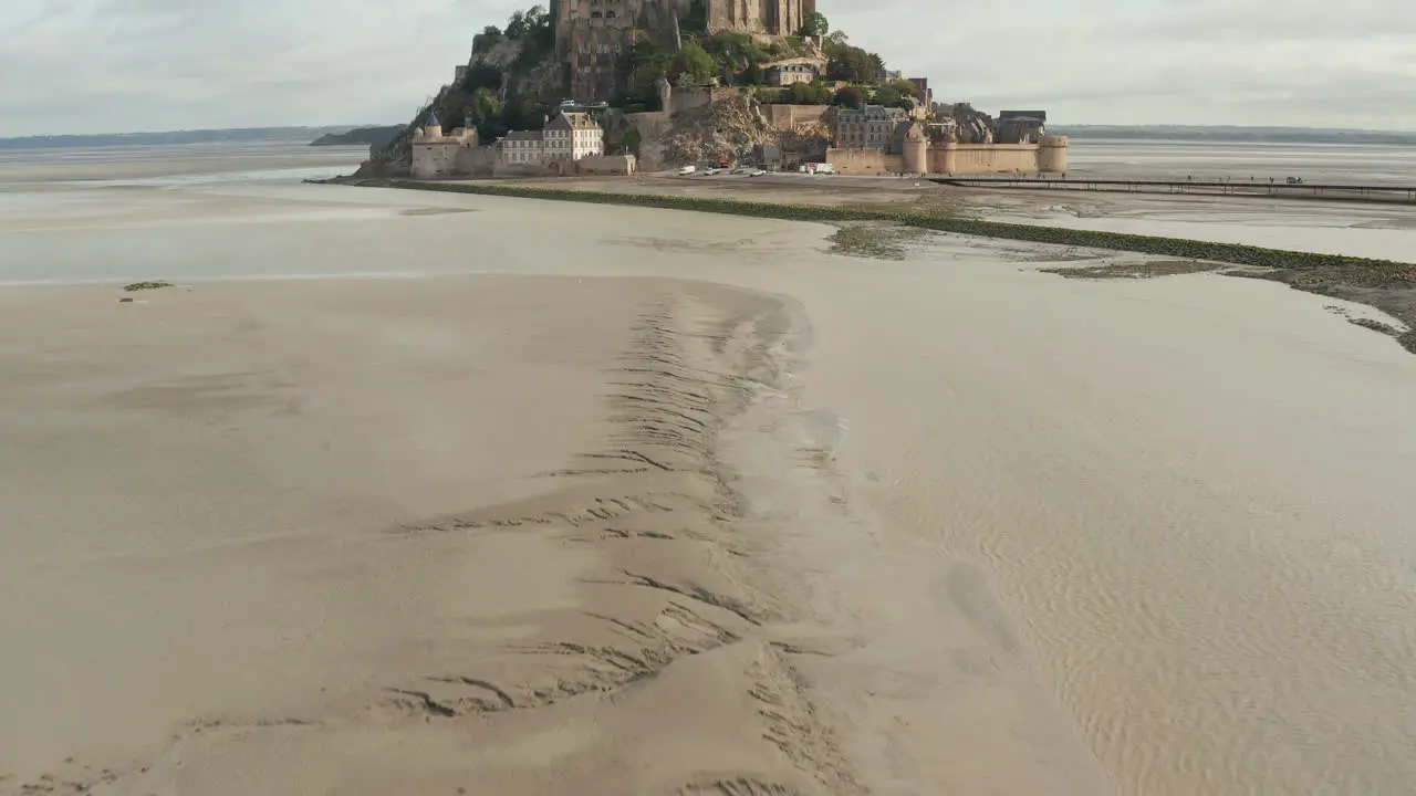 French Castle in Ocean Mont Saint Michel Aerial Establishing shot forward cloudy weather