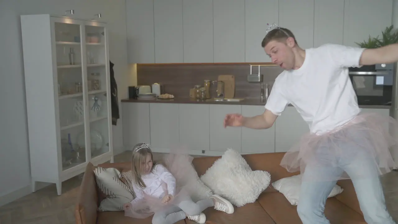 Little Daughter And Her Father Playing As Princesses And Fairies At Home