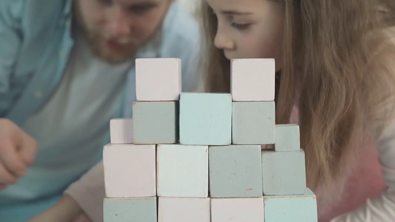 Close Up Of Little Daughter Dressed As A Princess Playing With Her Daddy At Home