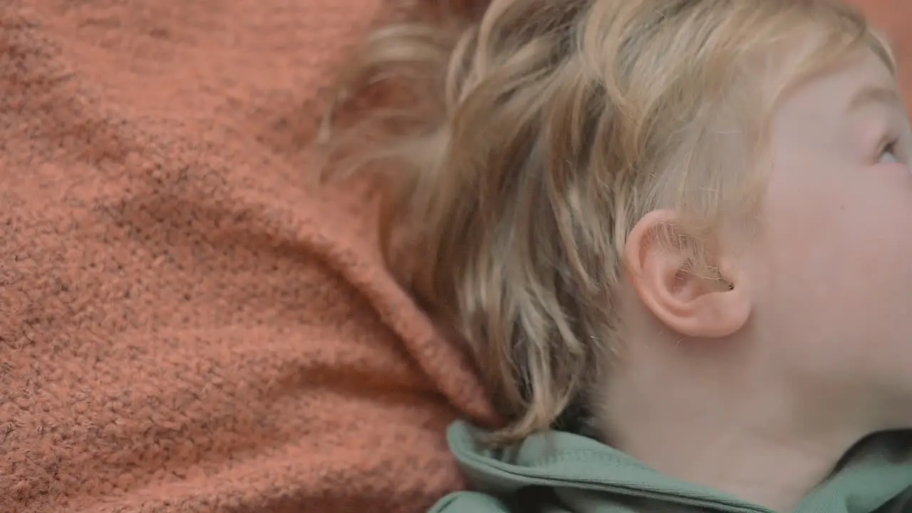 Portrait Of Little Boy Using A Smartphone Watching A Movie