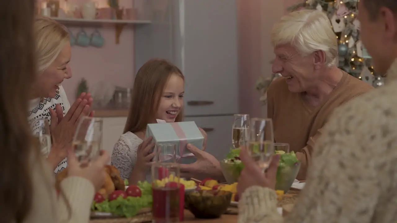 Grandparents Give A Surprise Present To Their Granddaughter