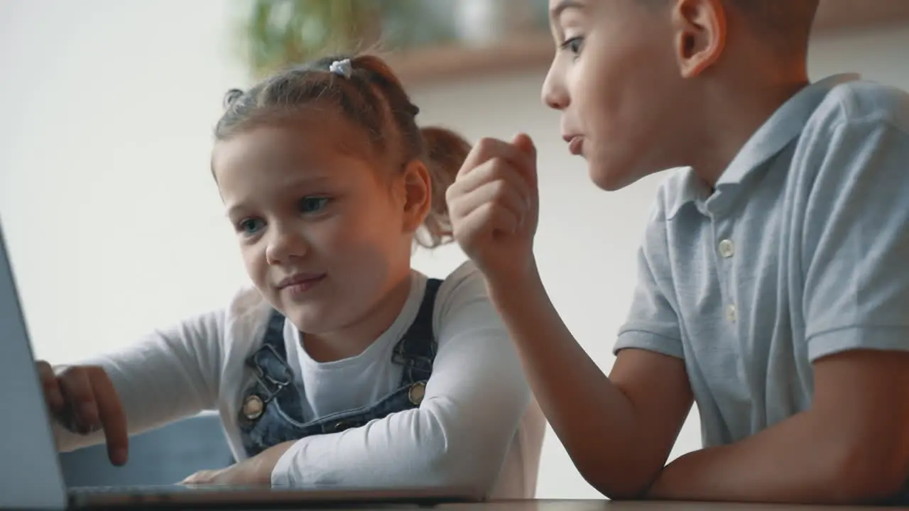 Little Boy And Girl Researching With A Computer