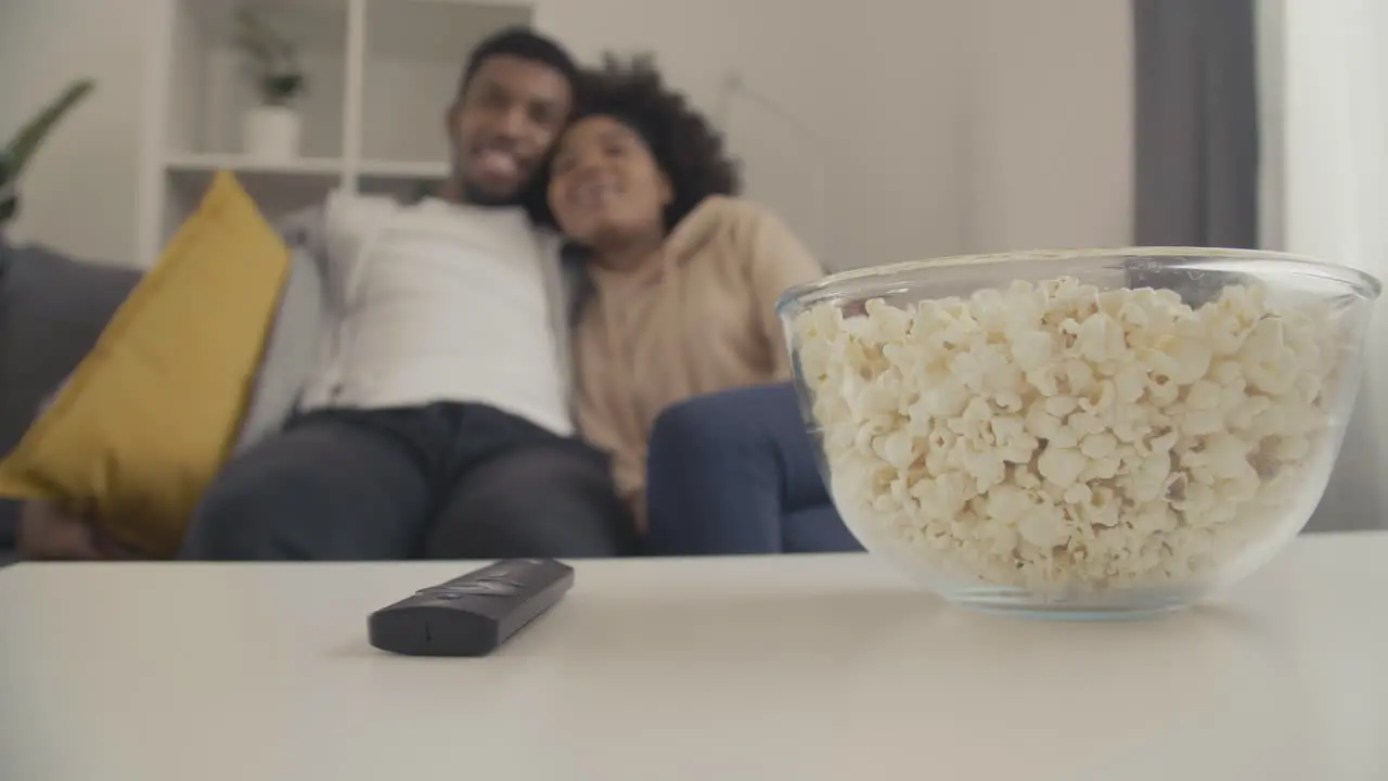 Details Of A Remote Control A Bowl Of Popcorn