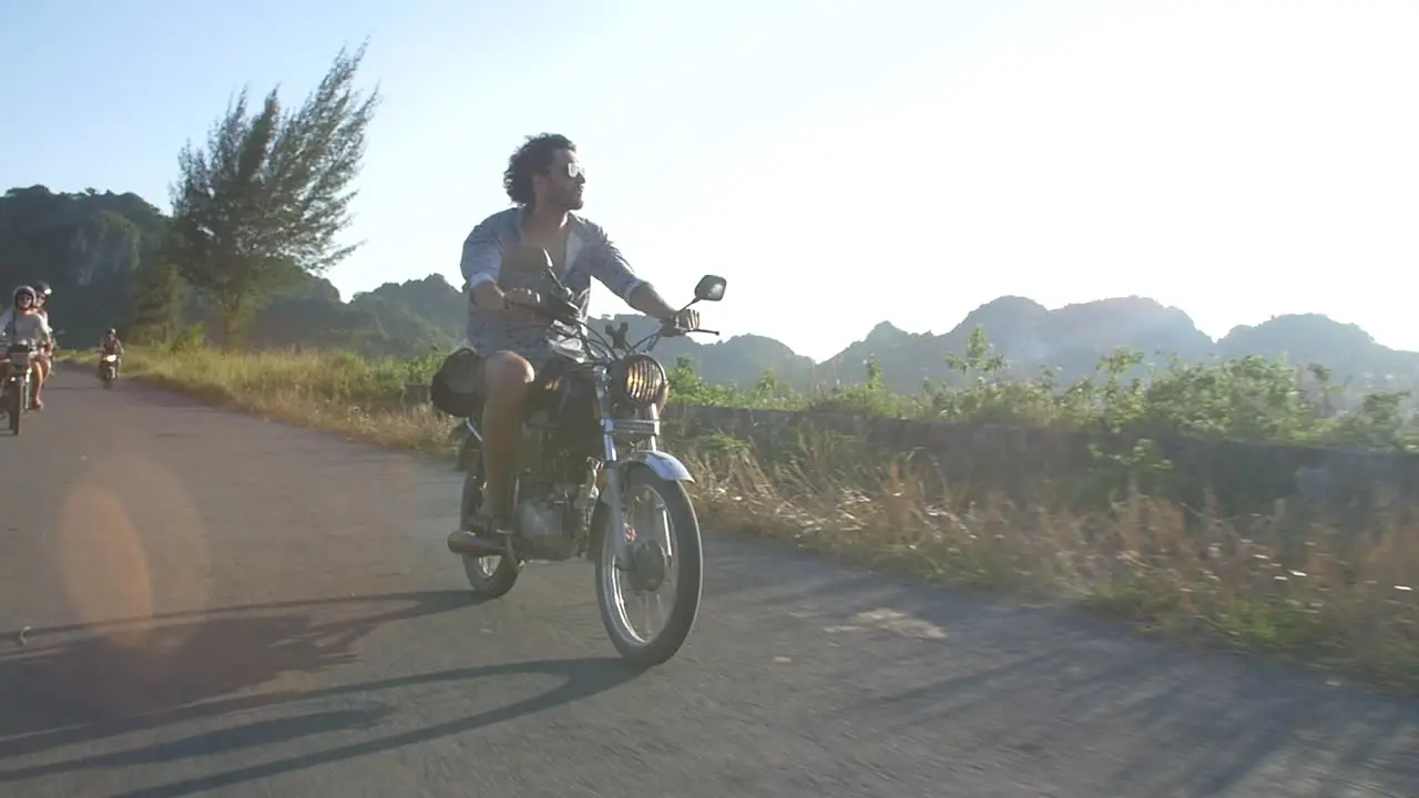 Man Riding on a Motorbike in Vietnam