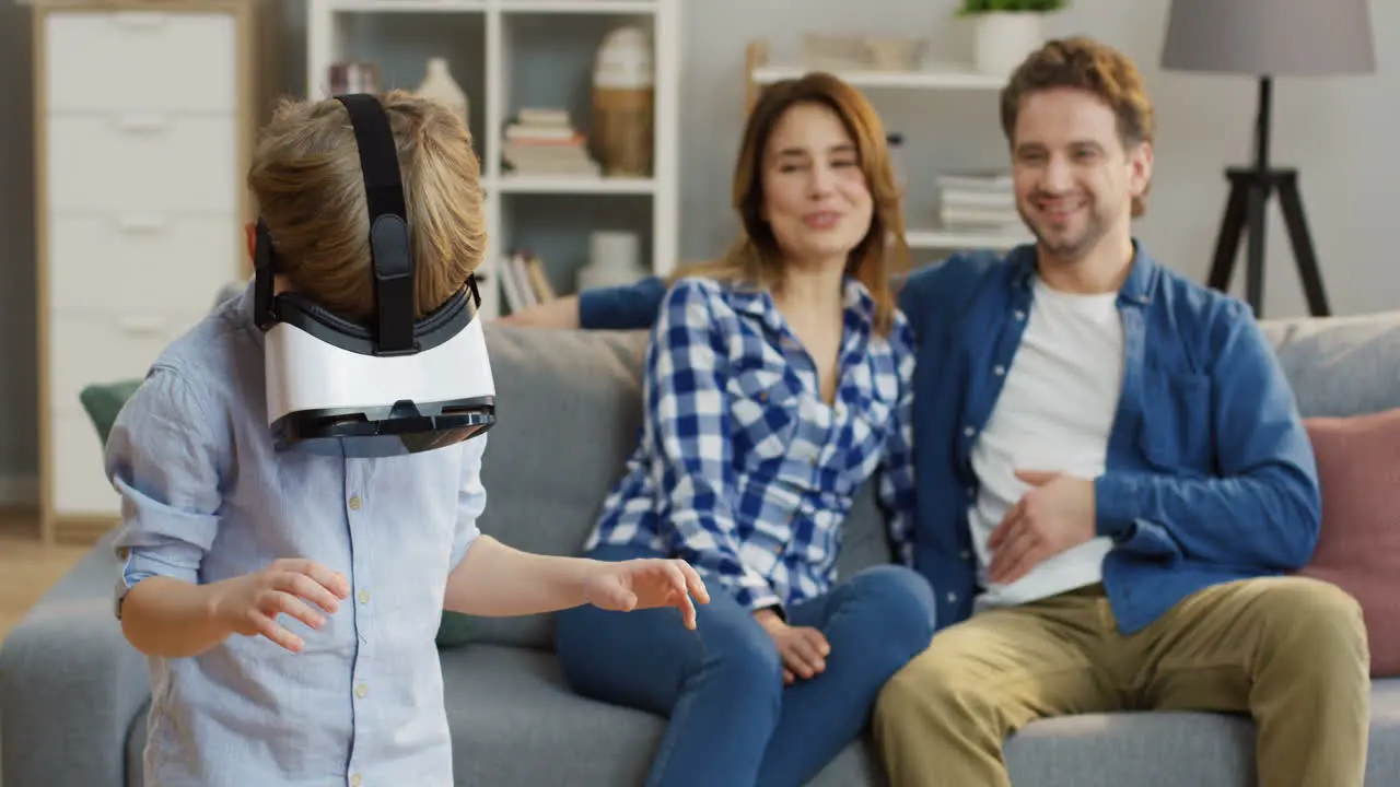 Small Cute Boy In The Vr Glasses Having A Vr Headset In The Living Room