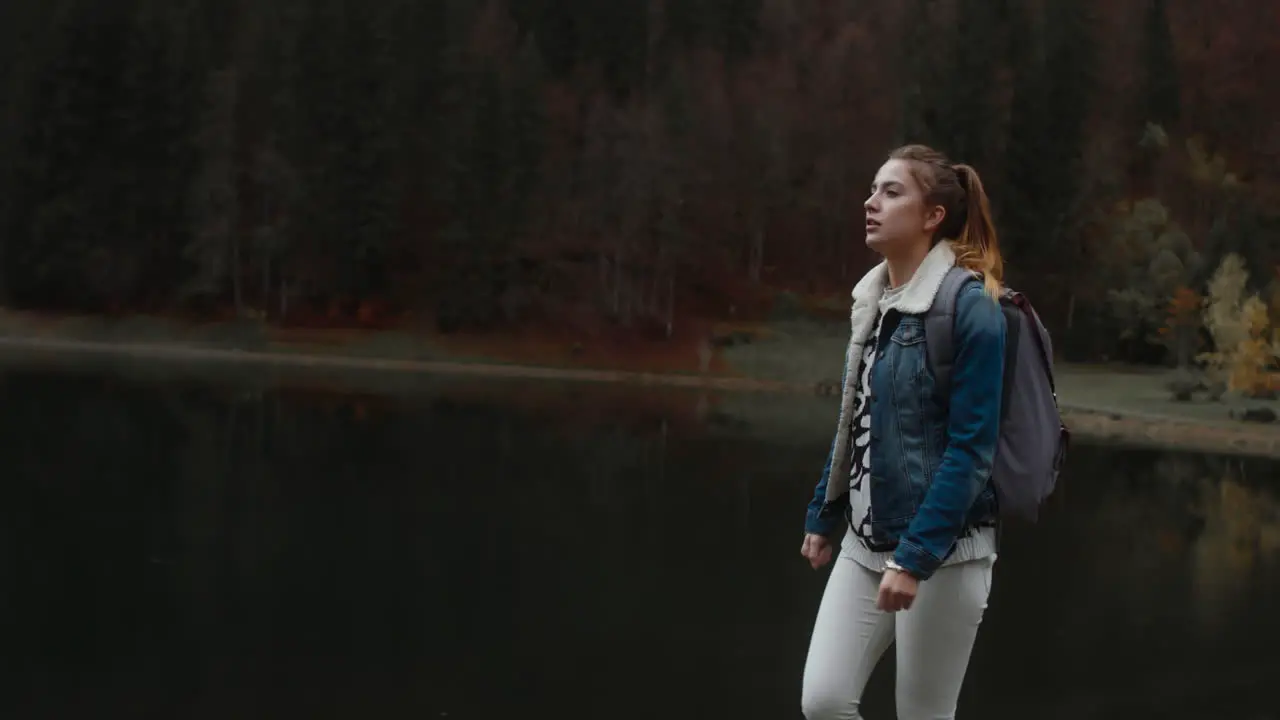 Woman Walking Alongside Lake 05