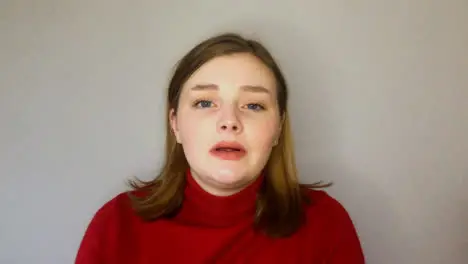 Female Young Student Greeting and Talking Directly to Camera