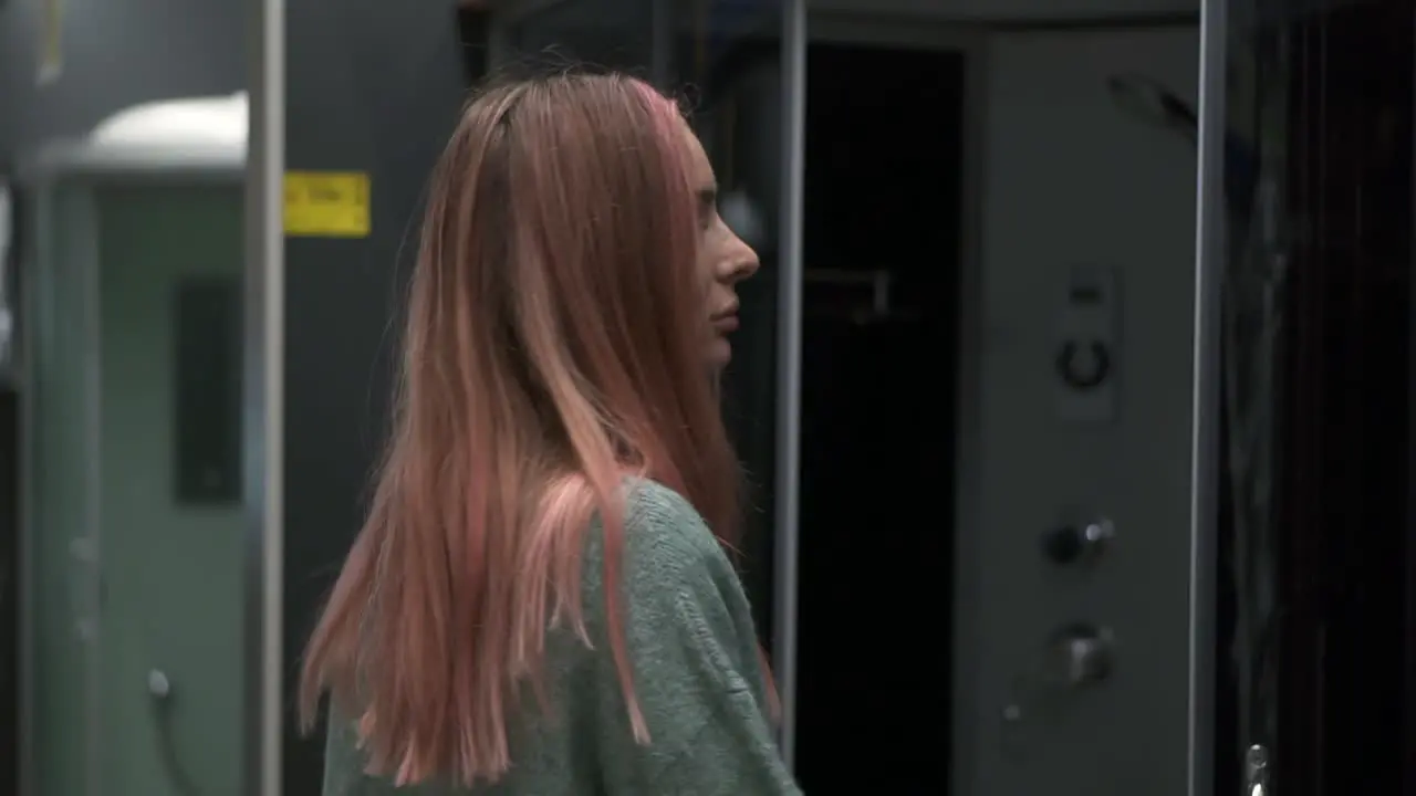 Long Haired Woman In Store Chooses A Shower Stall For The Bathroom