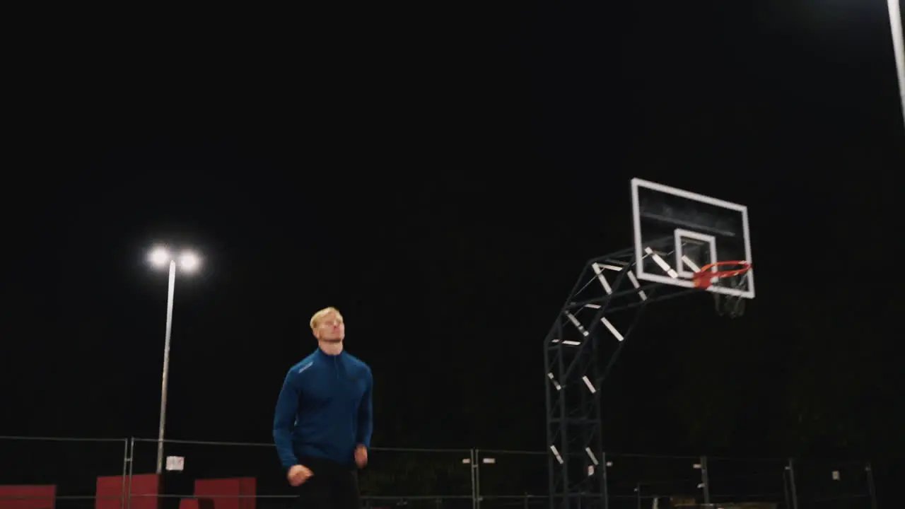 Focused Blond Man Running In The Park At Night 4