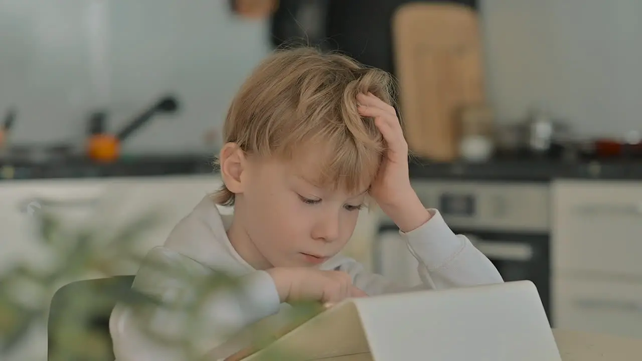 Child With Tablet Using Apps At Home