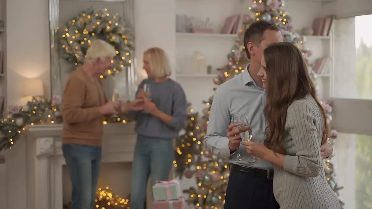 Young And Old Husband And Wife Celebrating Christmas