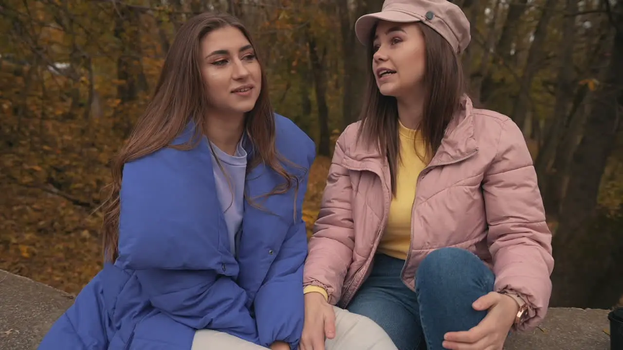 Young Female Friends Talking Outside