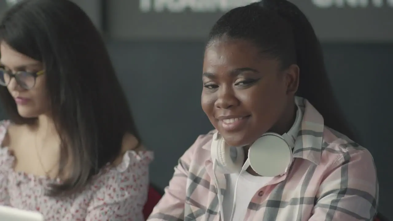 Pretty Black Student Girl Looking At The Camera And Smiles