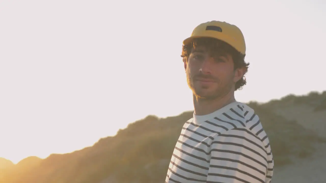 Portrait Of Athlete Man With Cap Smiling And Looking At Camera 1