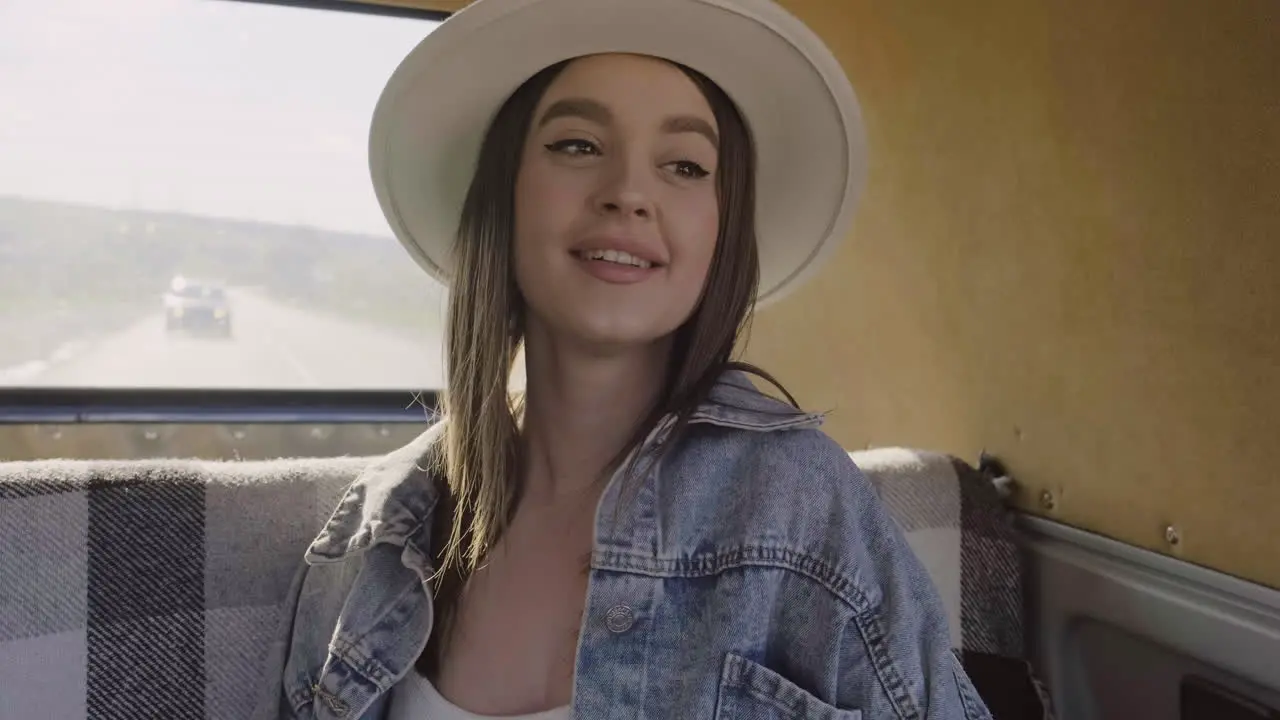 A Young Female Having Fun During A Roadtrip In The Caravan