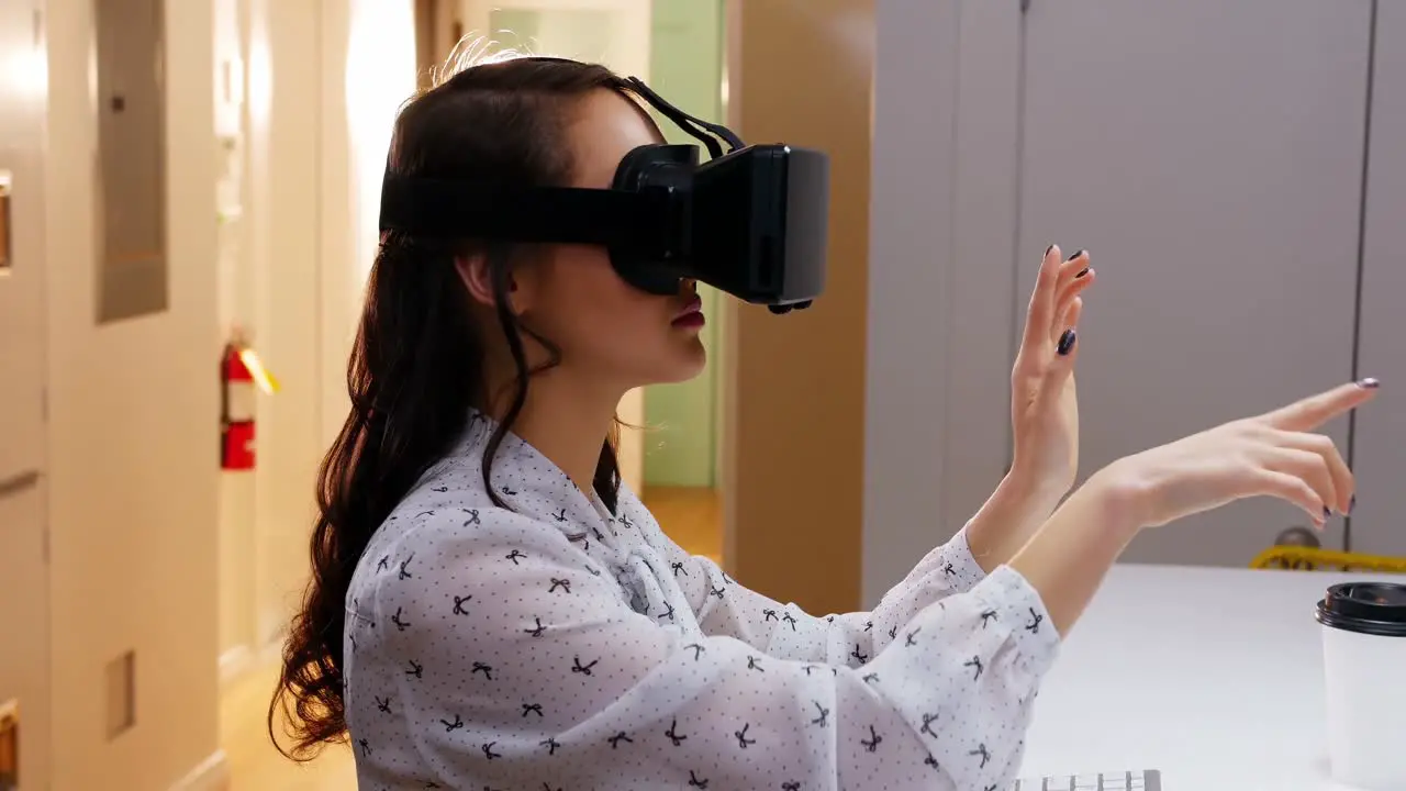 Female executive using virtual reality headset