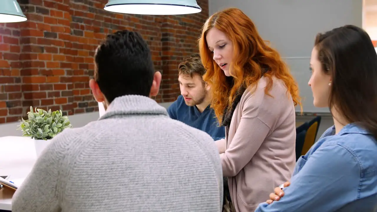 Business executives having discussion at desk