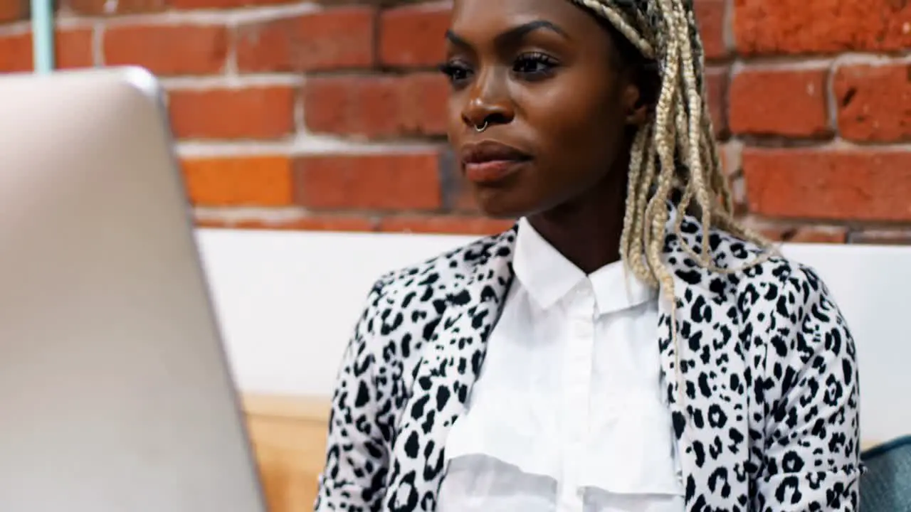 Female executive working on personal computer at desk