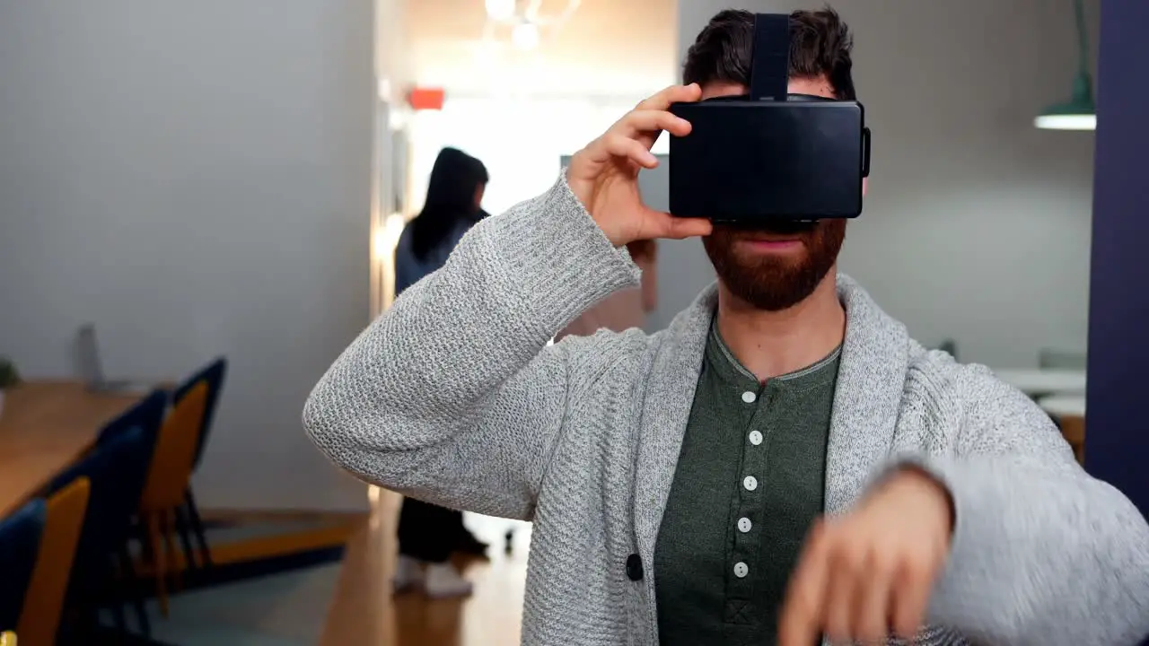 Male executive using virtual reality headset