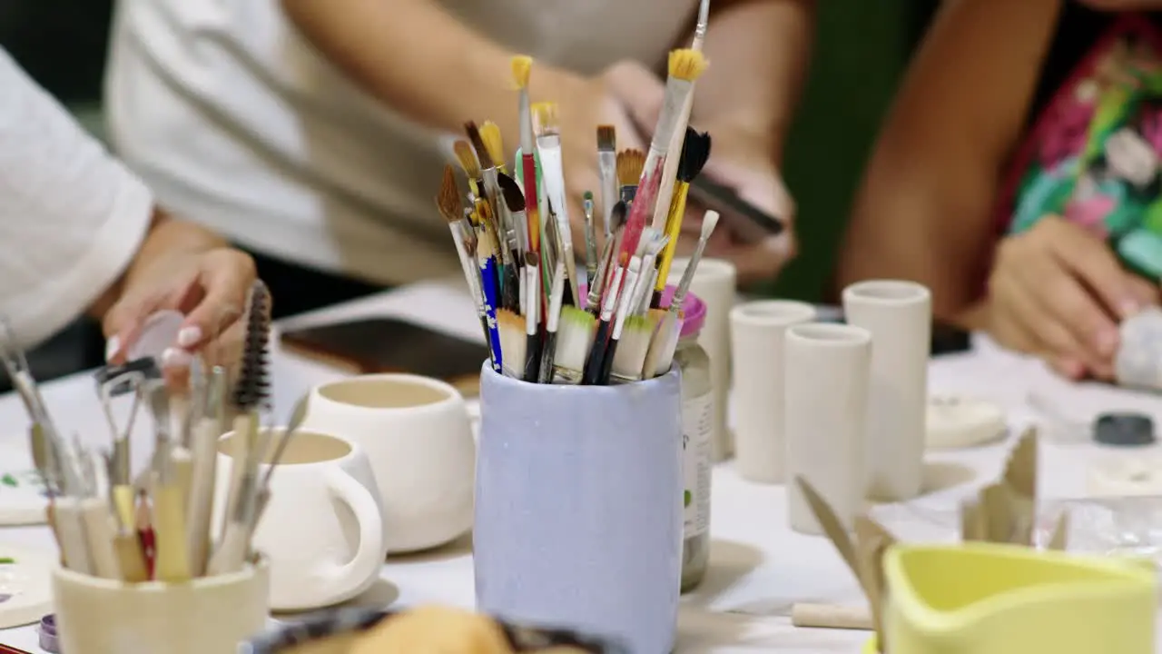 workday in a ceramic workshop with a focus on the central placement of molding utensils offering a glimpse into the creative process and craftsmanship involved in ceramic artistry