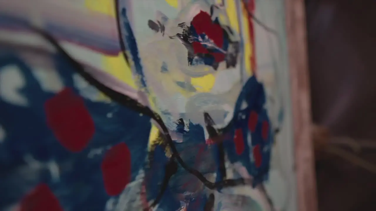 In this captivating slow-motion detail shot of an art picture canvas revealing the intricate texture and nuanced brush strokes that make up the painting's essence with blending colours