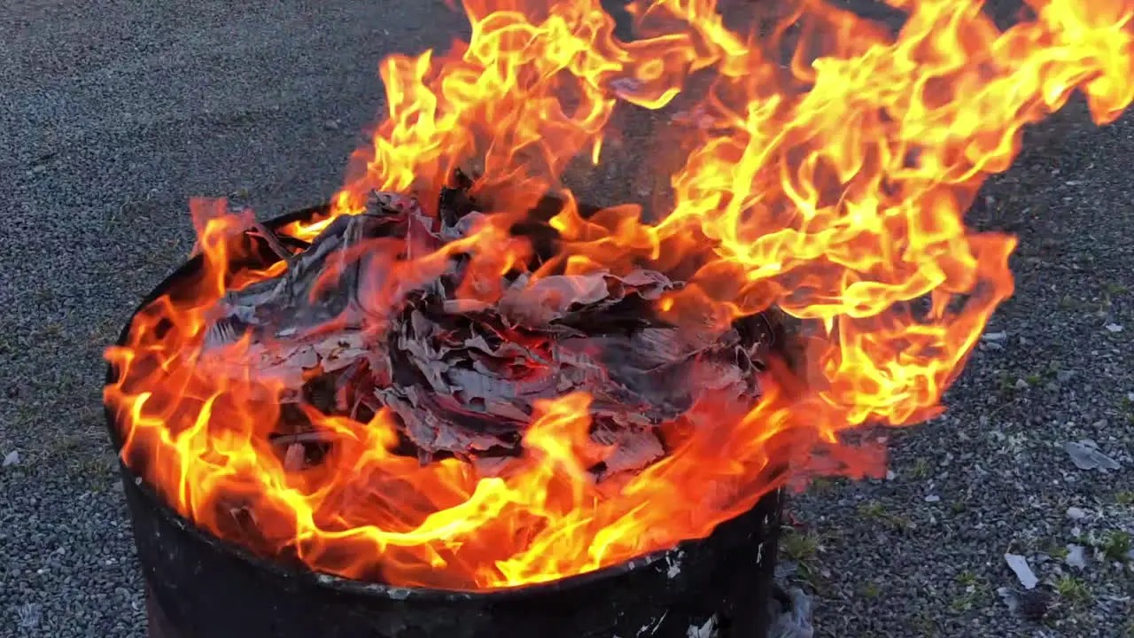 Fire burning in an oil drum at 50% speed