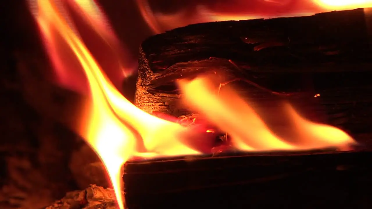 Close up of flaming logs in wood burning stove