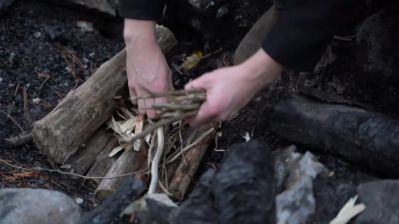 placing woods in the fire pit