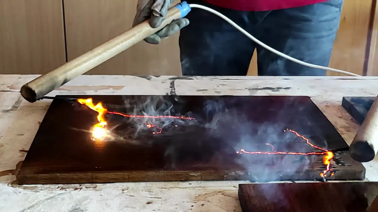 Fractal wood burning with high voltage electricity in woodworking shop