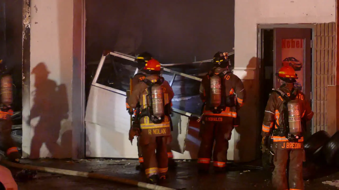 Firefighters trying to access burning property