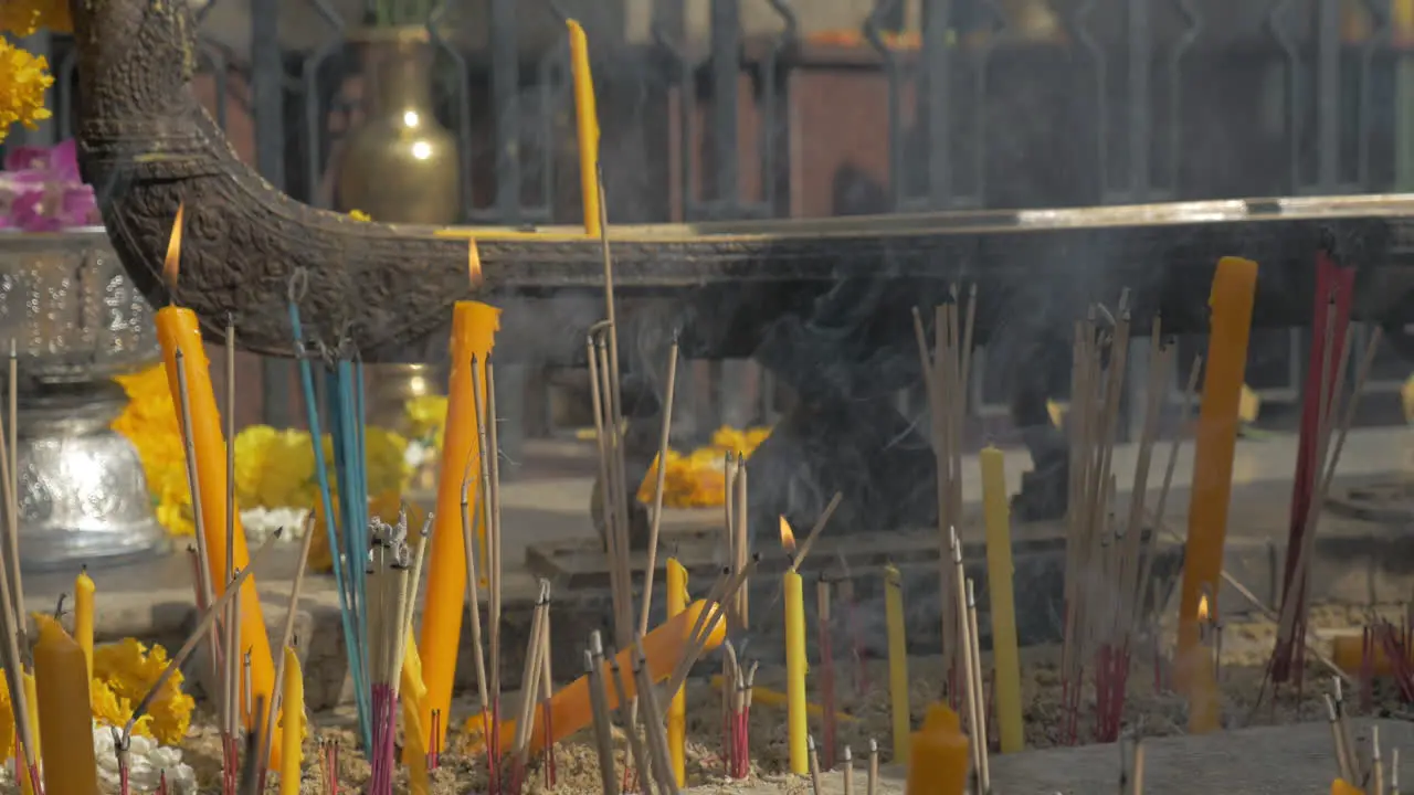 Burning incense and candles in Bangkok Thailand