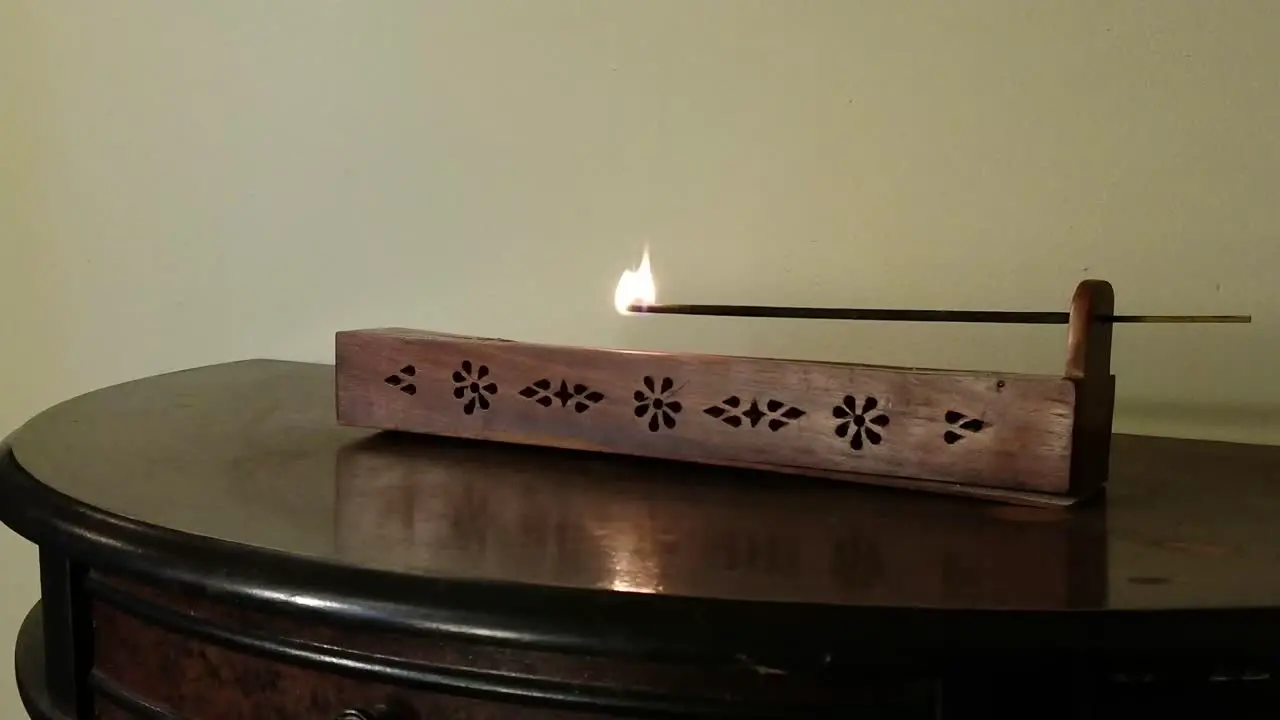 Man Prepares Incense Burner in Closeup