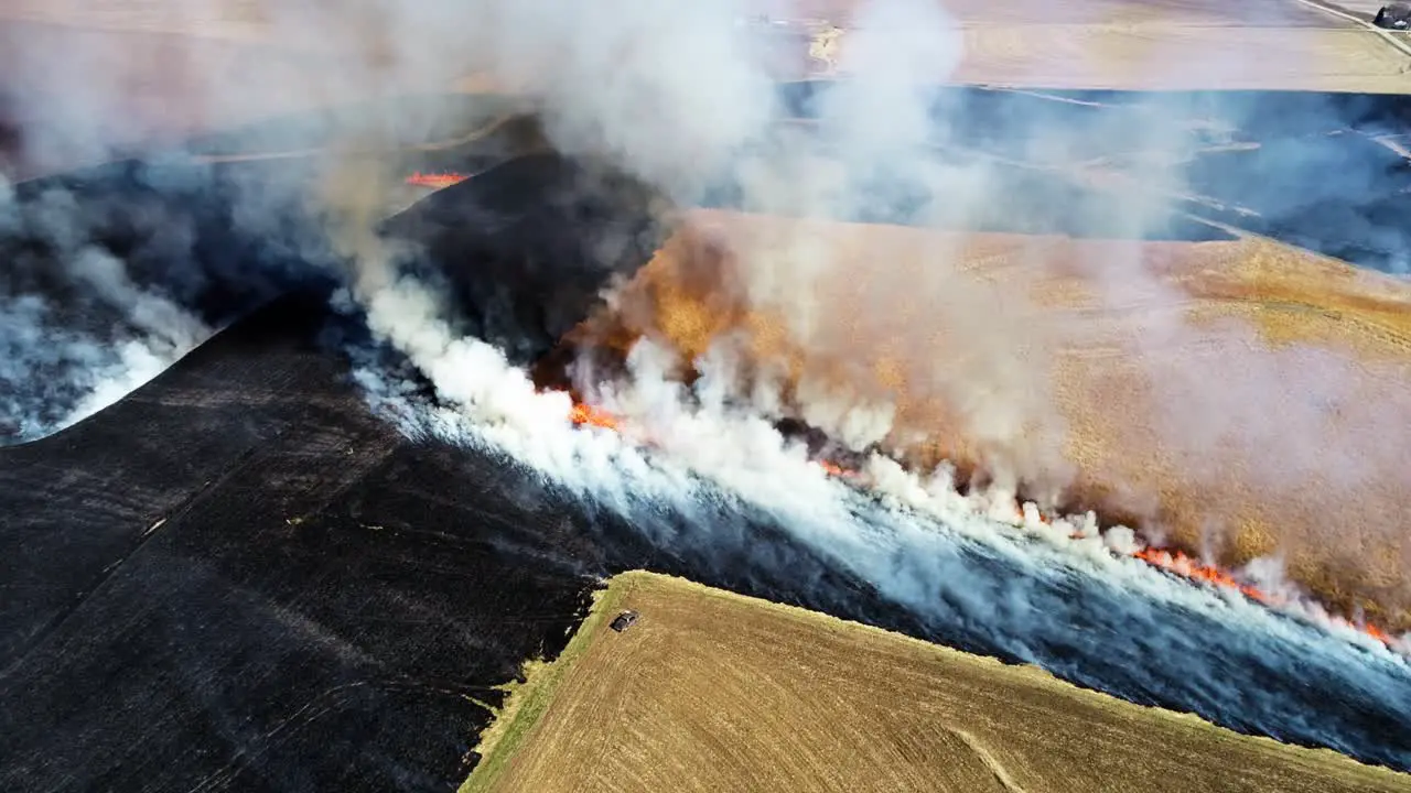 Aerial view of big smoke clouds and prairie burning