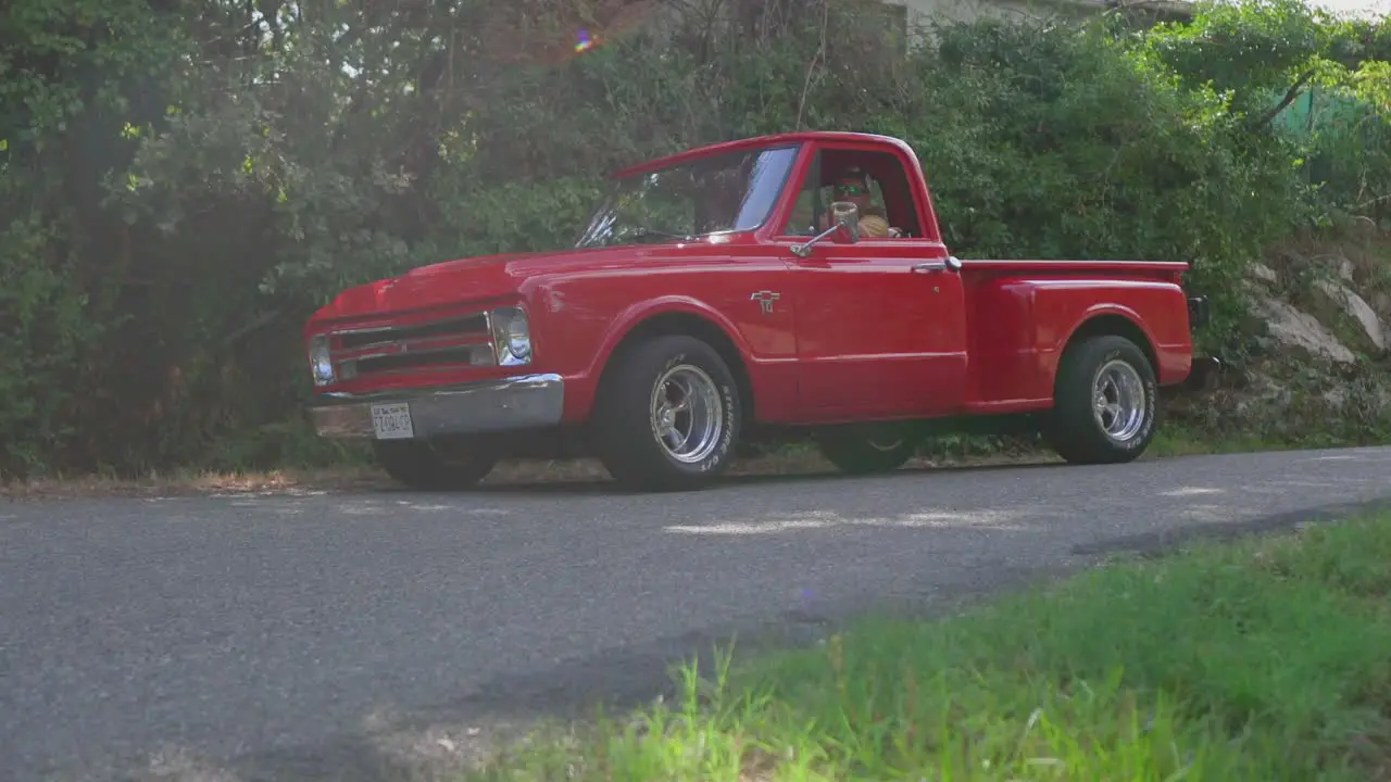 Chevrolet C10 Car Rolling shot on country road during sunny day