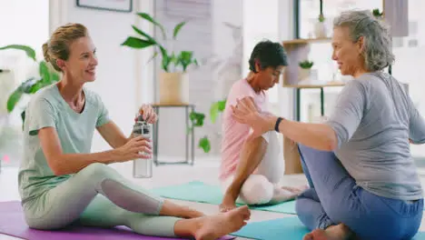 Mature women stretching after yoga class