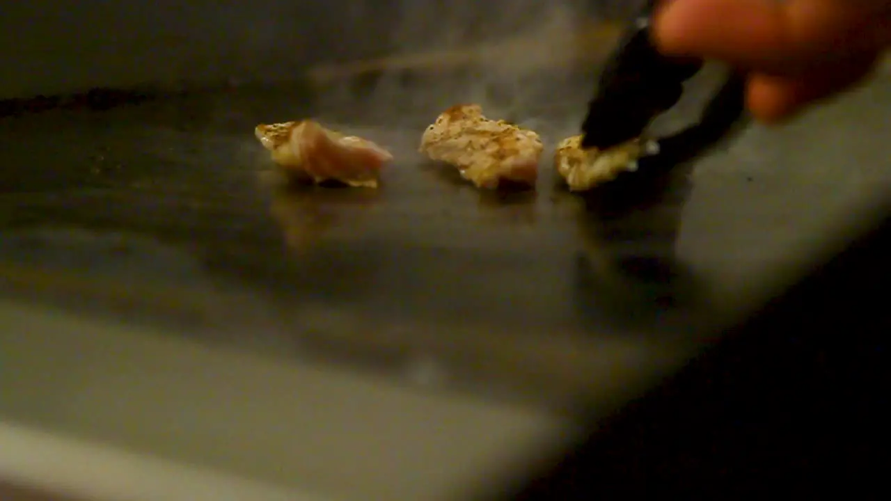 chef grilling fish at a restaurant