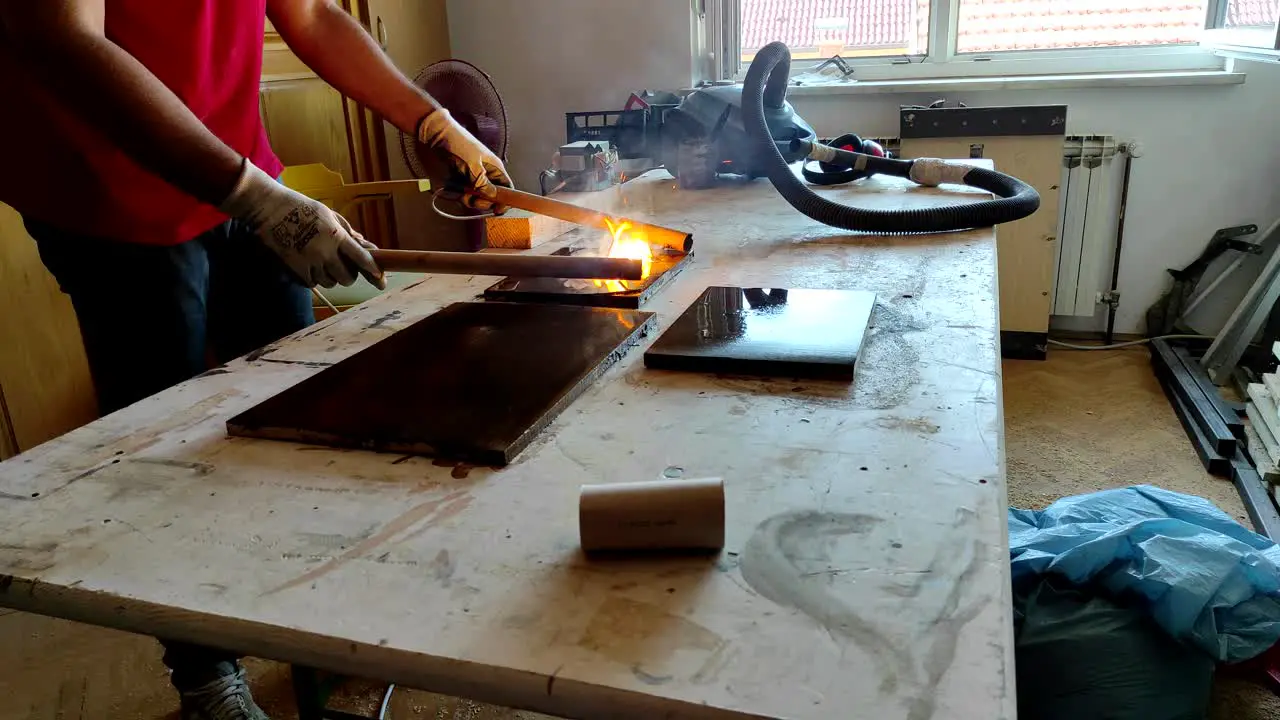 Flames and sparks while burning wood with high voltage electricity in small woodworking shop