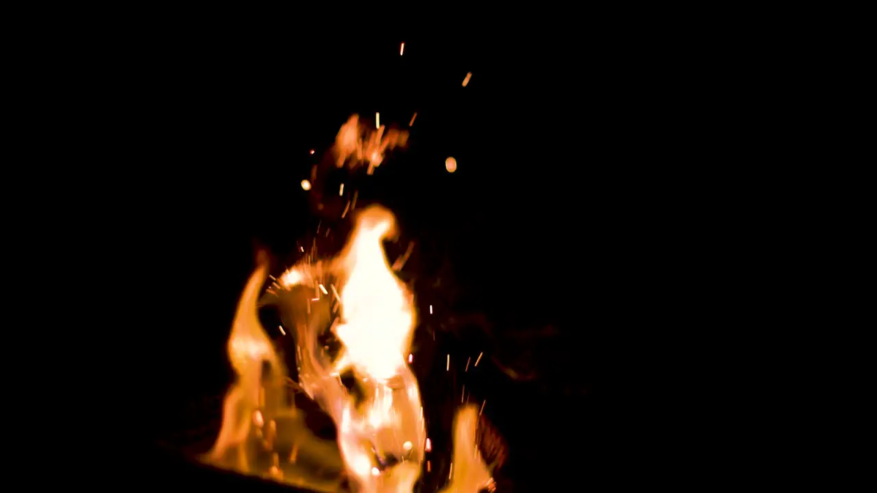 Pretty sparks flying out of a fire 4k slow motion 100fps