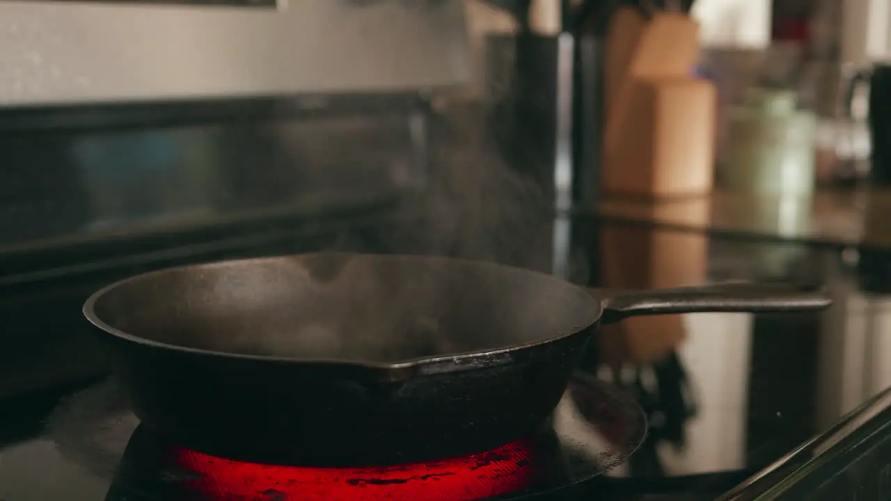 Putting butter in a hot cast-iron skillet and it smokes as it melts