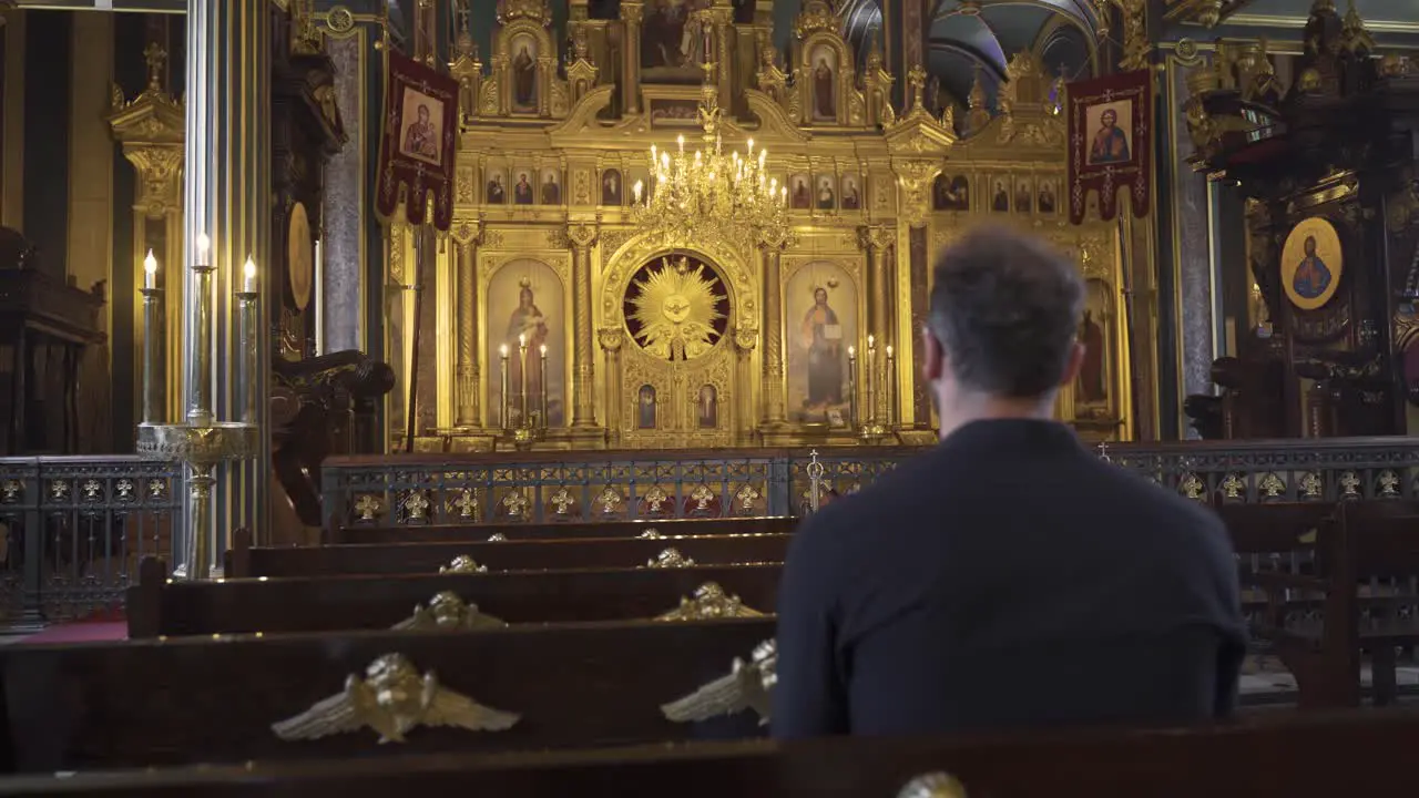 Man worshiping in church