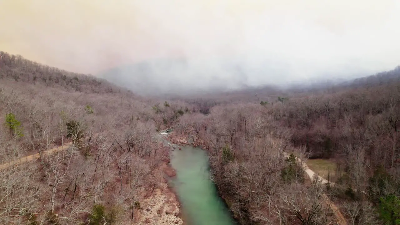 Forest Fire over a River Drone Footage