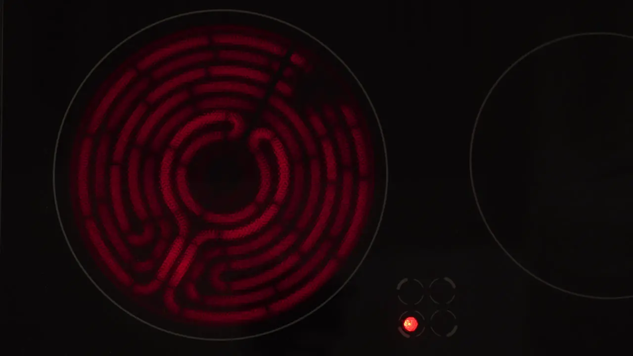 Heated electric stove turning off closeup