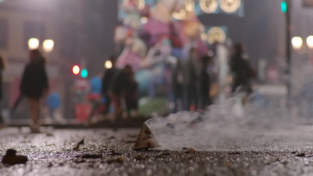 Burning firecracker flying away during Fallas celebration in Spain