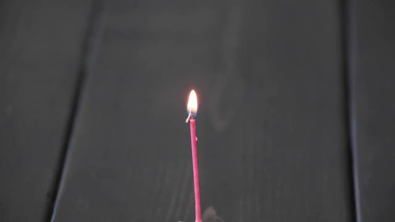 A time lapse of a birthday candle burning down