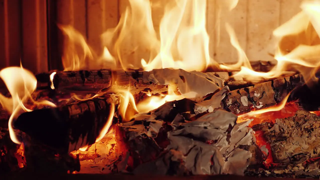 Crumpled Pieces Of Paper Documents Are Burned In A Fireplace