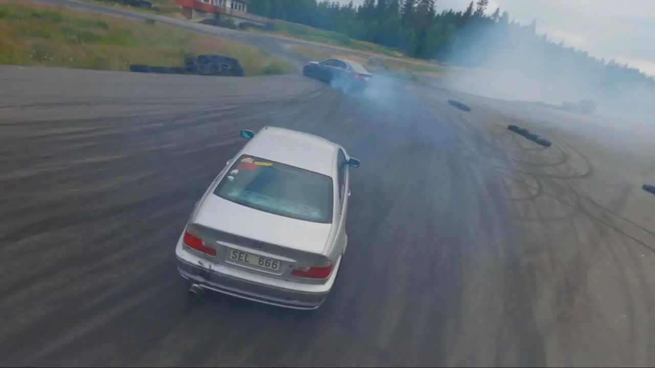 Two BMW cars synchronised drifting in Borås