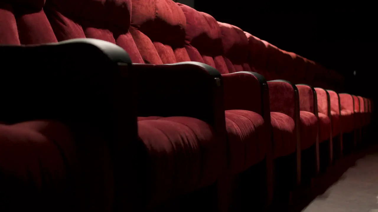 Side View Of Red Empty Seats In The Cinema