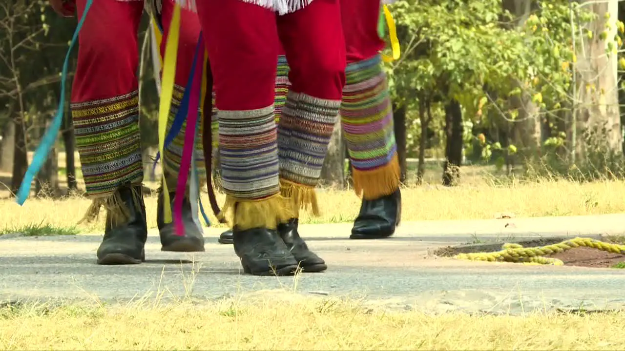 Papantla flyers performing a tradintional mexican dance before climbing the pole